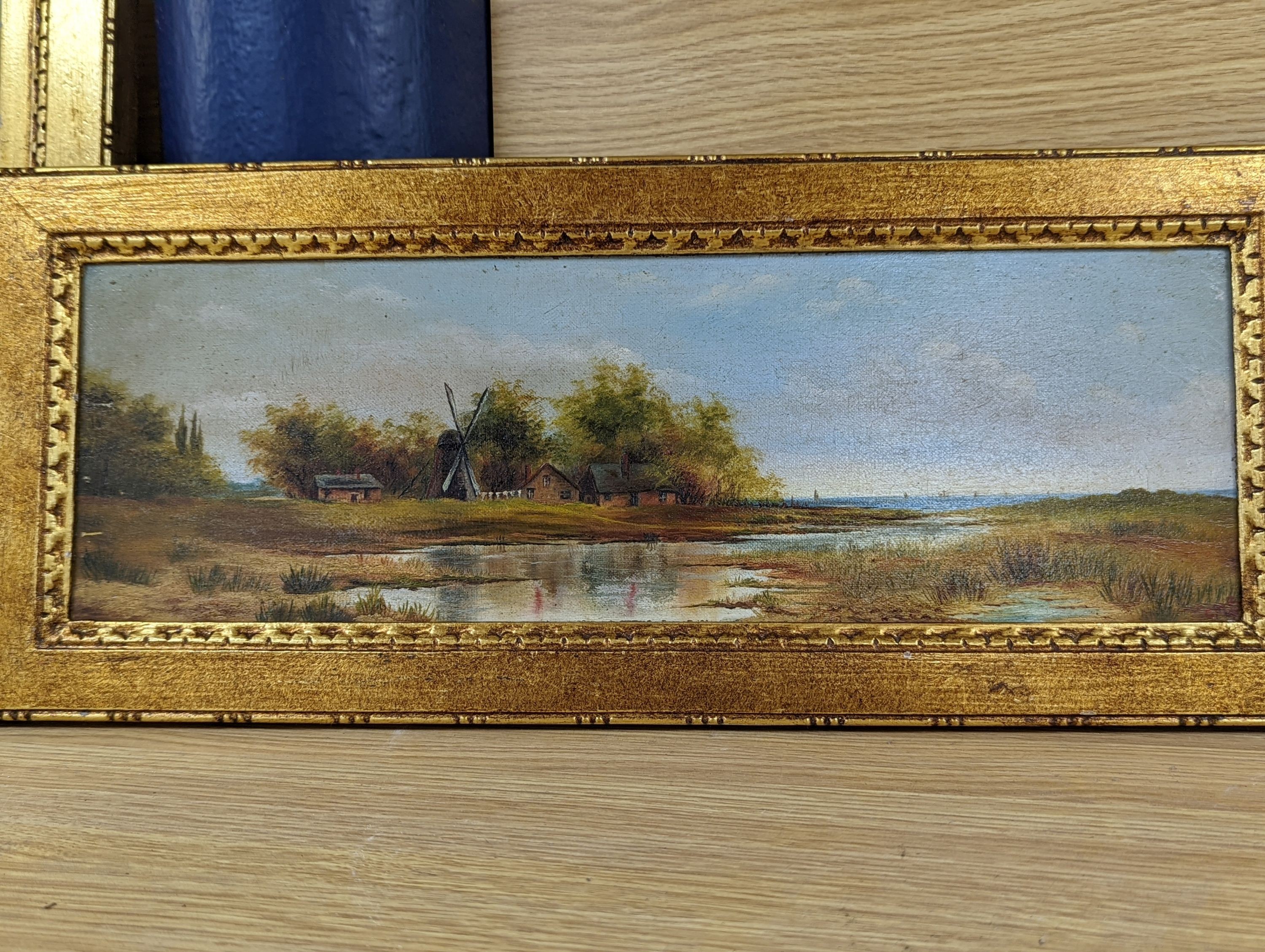 C. M. Garland, pair of oils on canvas, Summer and Winter landscapes, signed and dated 1891, 13 x 42cm and an oil of figures beside a pond, 1892, 27 x 37cm